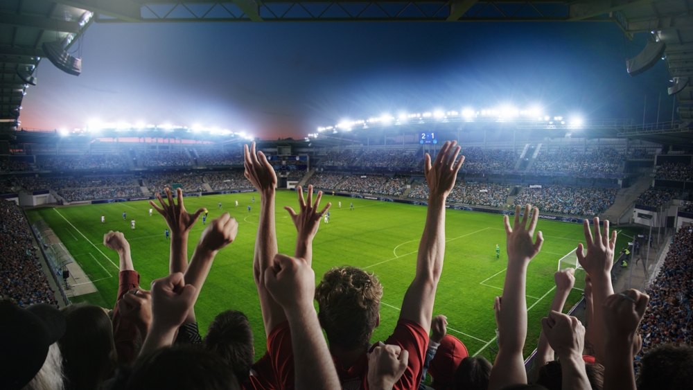 Establishing,Shot,Of,Fans,Cheer,For,Their,Team,On,A