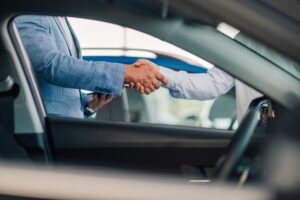 A,Final,Handshake,And,Exchange,Of,Car,Keys,Between,Two